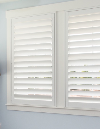 White plantation shutters with hidden tilt rods in Minneapolis